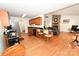 Open kitchen boasts wood cabinets, granite counters, eat-in bar, and access to a cozy living space with fireplace at 1353 33Rd Avenue Ne Dr, Hickory, NC 28601