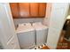 Functional laundry room with a washer and dryer, cabinet, and closet at 1353 33Rd Avenue Ne Dr, Hickory, NC 28601