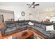 A large sectional sofa in living room with wood floors, ceiling fan, and lots of natural light at 1353 33Rd Avenue Ne Dr, Hickory, NC 28601