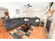 Open concept living room with stone fireplace, hardwood floors, and views of kitchen at 1353 33Rd Avenue Ne Dr, Hickory, NC 28601