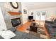 Spacious living room features stone fireplace, hardwood floors and french doors at 1353 33Rd Avenue Ne Dr, Hickory, NC 28601