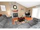Cozy living room boasts a stone fireplace, hardwood floors, and natural light at 1353 33Rd Avenue Ne Dr, Hickory, NC 28601