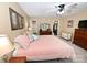Serene main bedroom with neutral colors, a ceiling fan, and direct access to an organized walk-in closet at 1353 33Rd Avenue Ne Dr, Hickory, NC 28601