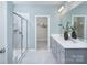 Modern bathroom featuring double vanity sinks, a spacious shower, and elegant tile flooring at 1468 Honey Trl, Monroe, NC 28112