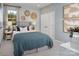 Cozy bedroom with a comfortable bed, soft lighting, and decorative wall art at 1468 Honey Trl, Monroe, NC 28112