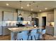 Modern kitchen featuring stainless steel appliances, granite countertops, a tiled backsplash, and a kitchen island at 1468 Honey Trl, Monroe, NC 28112