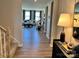 Open-concept living area with hardwood floors, abundant natural light, and a view of the outdoor scenery at 1468 Honey Trl, Monroe, NC 28112