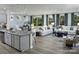 Bright and airy living space seamlessly blending the kitchen, dining, and living areas with backyard access at 1468 Honey Trl, Monroe, NC 28112