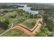 Aerial view of a newly constructed home on a large lot with lake access and scenic surroundings at 15170 Cove Point Ln, Norwood, NC 28128