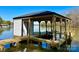 A private boat dock with a covered area and a lift, providing convenient access to the water at 15170 Cove Point Ln, Norwood, NC 28128