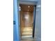 A modern elevator with sleek interior and soft lighting offers easy access to multiple floors at 15170 Cove Point Ln, Norwood, NC 28128