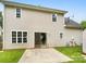 Backyard featuring a concrete patio, a sliding glass door, and lawn at 15188 Eric Kyle Dr, Huntersville, NC 28078