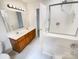 Modern bathroom with dual vanity, bright lighting, and walk-in shower at 15188 Eric Kyle Dr, Huntersville, NC 28078
