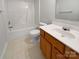 Bright bathroom featuring a single sink vanity and tub with shower at 15188 Eric Kyle Dr, Huntersville, NC 28078