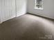 Cozy carpeted bedroom with a window and closet at 15188 Eric Kyle Dr, Huntersville, NC 28078