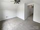 Spacious carpeted bedroom with a ceiling fan and walk in closet at 15188 Eric Kyle Dr, Huntersville, NC 28078