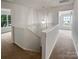 Hallway featuring a staircase and a pendant light at 15188 Eric Kyle Dr, Huntersville, NC 28078