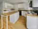 Spacious kitchen with white cabinets, wood countertops, and a kitchen island at 15188 Eric Kyle Dr, Huntersville, NC 28078