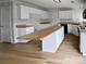 Bright kitchen with ample counter space and an oversized island at 15188 Eric Kyle Dr, Huntersville, NC 28078