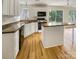 Charming kitchen with white cabinets, butcher block countertops, and stainless steel appliances at 15188 Eric Kyle Dr, Huntersville, NC 28078