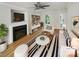 Bright living room with hardwood floors, fireplace, and stylish furniture at 15188 Eric Kyle Dr, Huntersville, NC 28078