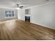 Spacious living room with hardwood floors and a fireplace at 15188 Eric Kyle Dr, Huntersville, NC 28078