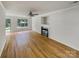 Bright living room with hardwood floors, fireplace, and large windows at 15188 Eric Kyle Dr, Huntersville, NC 28078