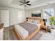 Comfortable bedroom featuring a tray ceiling, a ceiling fan, and natural light at 15188 Eric Kyle Dr, Huntersville, NC 28078