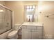 Clean bathroom featuring a vanity and shower-tub combo at 1520 Royalty Cir, Statesville, NC 28625