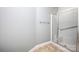 Bathroom shower with glass door, tile floors, and metal towel rack at 1520 Royalty Cir, Statesville, NC 28625