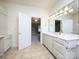 Bathroom featuring dual sinks, vanity with storage, tile floors, and mirror at 1520 Royalty Cir, Statesville, NC 28625