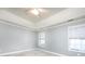 Bedroom with neutral walls, two windows with blinds, and carpeted floors at 1520 Royalty Cir, Statesville, NC 28625
