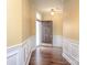 Welcoming entryway features wood flooring and decorative wainscoting, creating a charming ambiance at 1520 Royalty Cir, Statesville, NC 28625