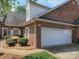 Charming brick home with a well-maintained lawn and a two-car garage at 1520 Royalty Cir, Statesville, NC 28625