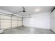Spacious garage with concrete floor, garage door with opener, a window and built-in storage cabinets at 1520 Royalty Cir, Statesville, NC 28625