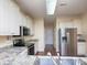 Modern kitchen with stainless steel appliances, granite countertops, and ample cabinet space at 1520 Royalty Cir, Statesville, NC 28625