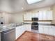 Bright kitchen equipped with stainless steel appliances and eat-in bar at 1520 Royalty Cir, Statesville, NC 28625
