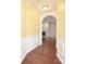 Elegant entryway featuring an archway that leads into a living room with hardwood floors at 1520 Royalty Cir, Statesville, NC 28625