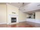 Open-concept living area with a fireplace that seamlessly flows into the kitchen and dining area at 1520 Royalty Cir, Statesville, NC 28625