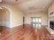 Spacious living room featuring hardwood floors, fireplace, and abundant natural light with a neutral color palette at 1520 Royalty Cir, Statesville, NC 28625
