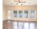 Sun Room area with three large windows, fan, and a glass door to the exterior at 1520 Royalty Cir, Statesville, NC 28625