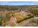 Drone shot showcases the property with approximated boundaries, the house, and natural surroundings at 1595 Cheatham Ford Rd, Hiddenite, NC 28636