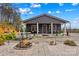 Back exterior features a fire pit, patio with ample seating, and a well-maintained stone walkway at 1595 Cheatham Ford Rd, Hiddenite, NC 28636