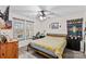 Bedroom with natural light, a bed, and a ceiling fan at 1595 Cheatham Ford Rd, Hiddenite, NC 28636