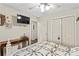 Comfortable bedroom featuring natural light, ceiling fan, and a patterned quilt at 1595 Cheatham Ford Rd, Hiddenite, NC 28636
