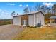 Large metal building with double doors and a covered patio, exterior view at 1595 Cheatham Ford Rd, Hiddenite, NC 28636