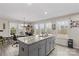 Eat-in kitchen view displaying a central island, plenty of natural light, and an open transition to the rest of the house at 1595 Cheatham Ford Rd, Hiddenite, NC 28636