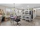 Bright eat-in kitchen featuring stainless steel appliances, gray cabinets, modern fixtures, and wood-look floors at 1595 Cheatham Ford Rd, Hiddenite, NC 28636
