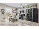 Well-lit kitchen with stainless steel appliances, neutral countertops, and ample cabinet space for storage at 1595 Cheatham Ford Rd, Hiddenite, NC 28636