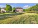 This is a large grass filled backyard with luscious green trees for privacy at 1650 Berkshire Dr, Hickory, NC 28602